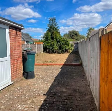 A side path jet washed clean beside a property, Braintree